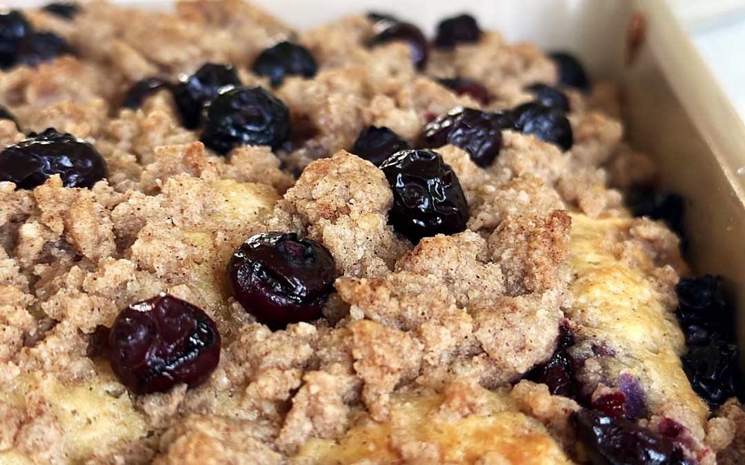 Blueberry Greek yogurt coffee cake in an 8x8 pan with cinnamon streusel and fresh blueberries on top